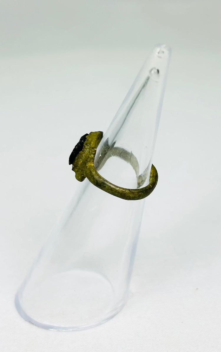 Roman Imperial bronze ring with deep patina and inset carved red glass intaglio
