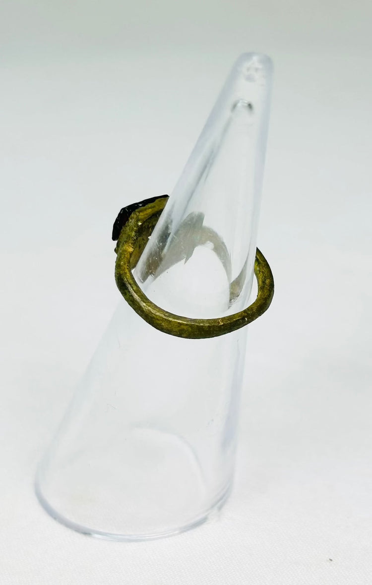 Detailed view of ancient Roman bronze ring showing age wear, cracking, and craftsmanship