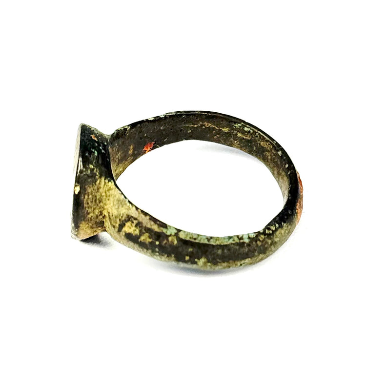 Ancient Eastern Mediterranean bronze finger ring, US size 8, with worn circular bezel and preserved green-brown patina