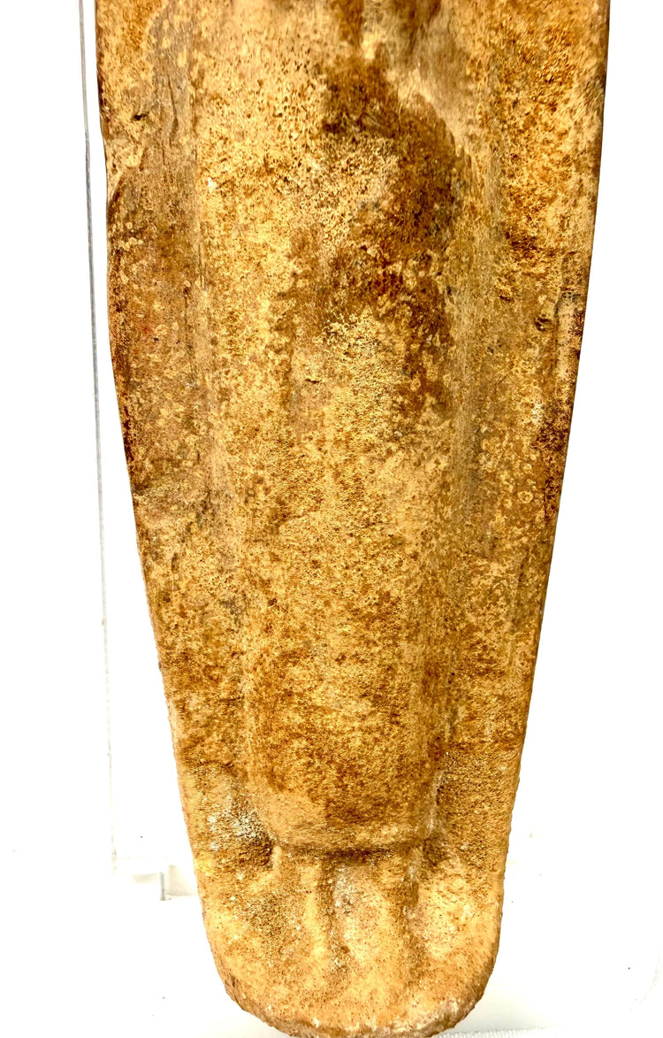 Ancient Roman fertility sculpture crafted from coarse terracotta clay with a compact human form and natural mineral deposits.