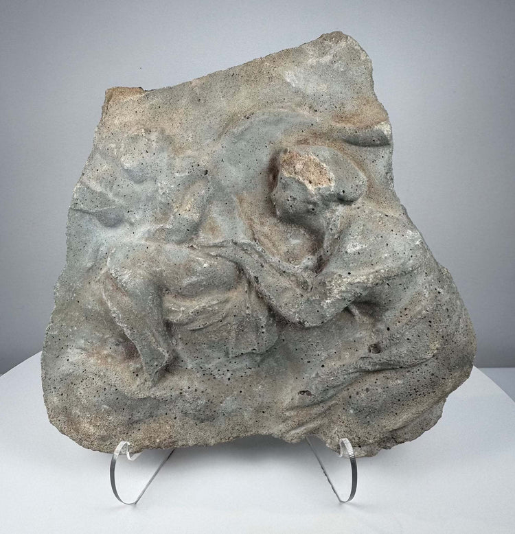 Roman volcanic tuff relief fragment with weathered Classical figures and ancient stone patina