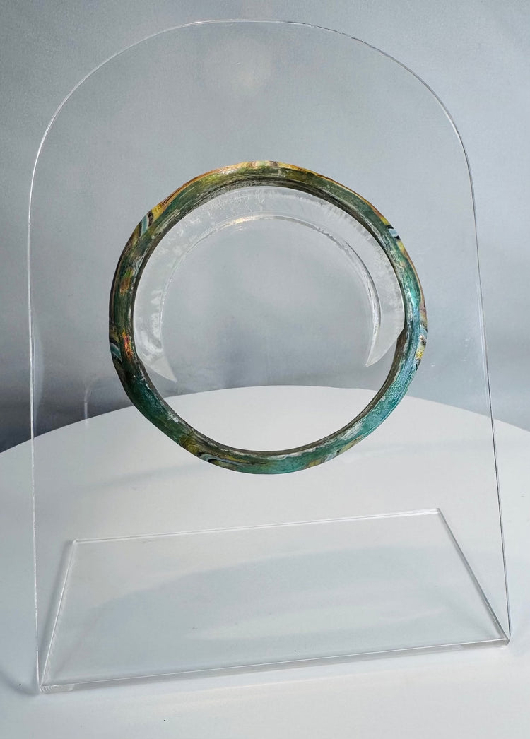 Roman Imperial mosaic glass bracelet preserved in a complete circular form with vibrant multicolored pattern.