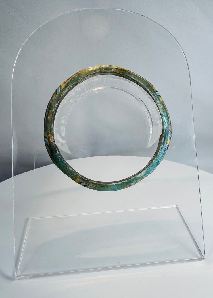 Roman Imperial mosaic glass bracelet preserved in a complete circular form with vibrant multicolored pattern.