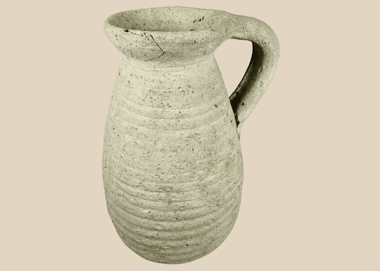 Ancient Roman North African terracotta pitcher from modern Tunisia with ribbed body and loop handle.