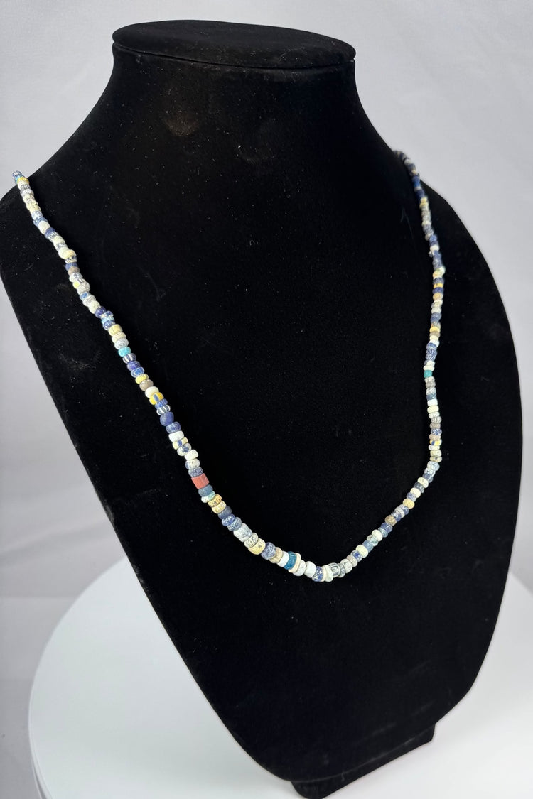 Ancient Mediterranean bead strand with cobalt blue, yellow, red, and white glass