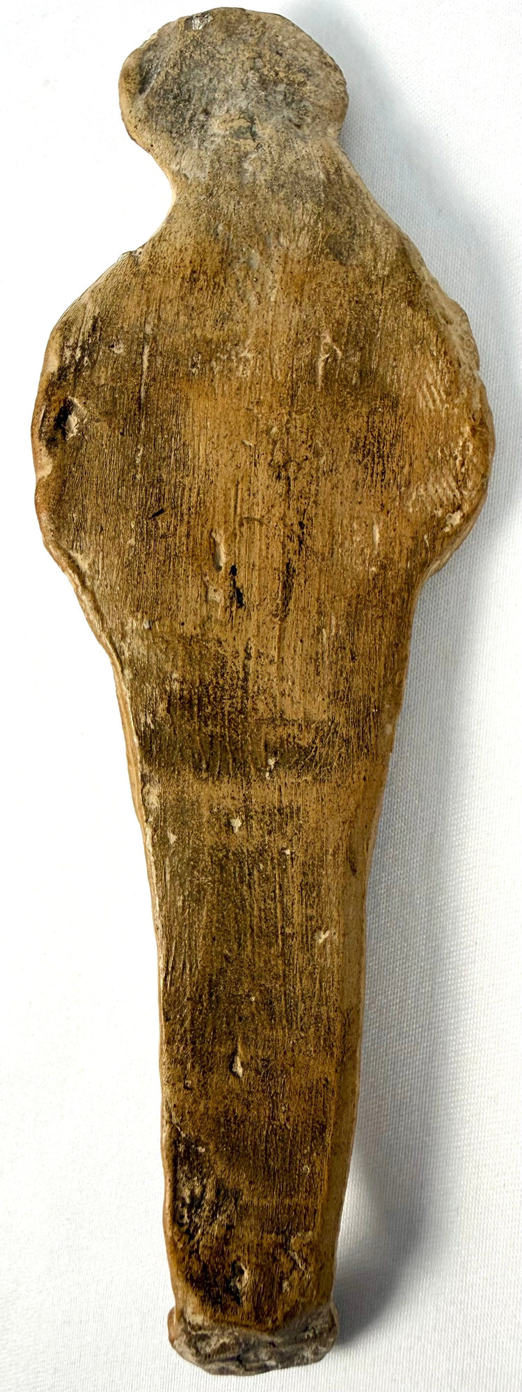 Ancient Roman ceremonial clay figurine with outstretched arms, stylized body proportions, and age-related surface abrasions.
