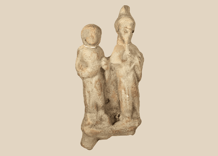 Ancient Greek terracotta votive figural group from Taormina, Sicily, depicting two standing human figures.