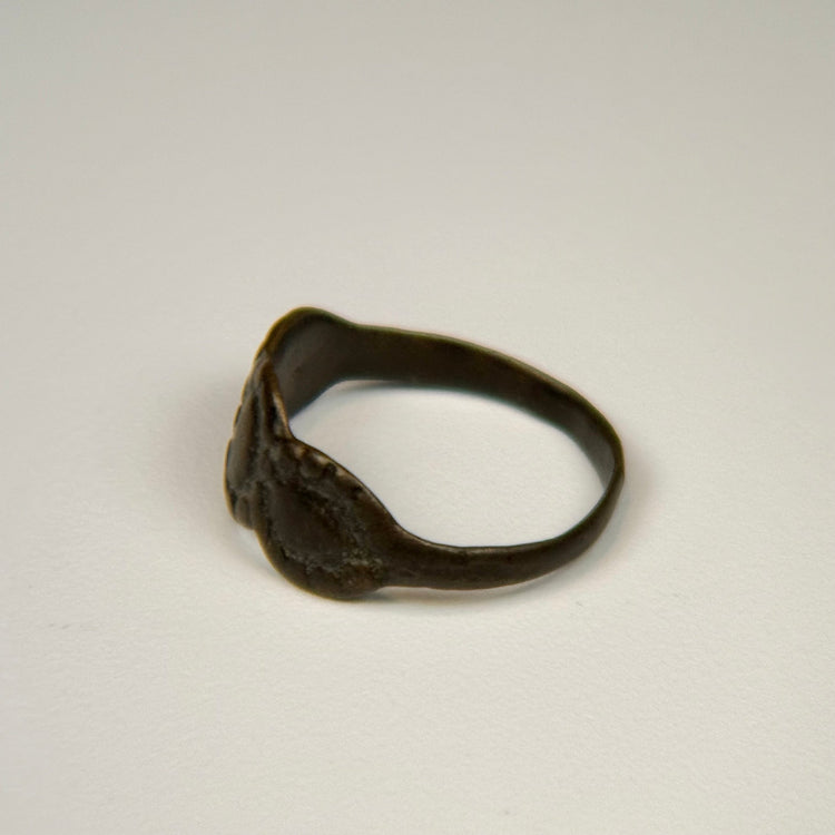Late Roman silver ring displaying three balanced oval forms across the decorative bezel