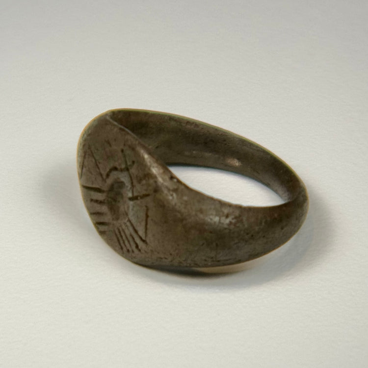 Late Roman silver ring displaying a clear celestial sunburst motif on the central bezel