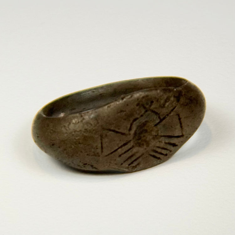 Ancient Roman to Byzantine silver ring featuring a symbolic sunburst design and slender rounded band