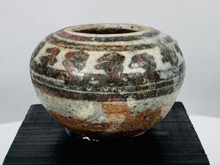 Ancient Southeast Asian ceramic vessels with underglaze iron-brown decoration, produced at the renowned Sawankhalok kilns.