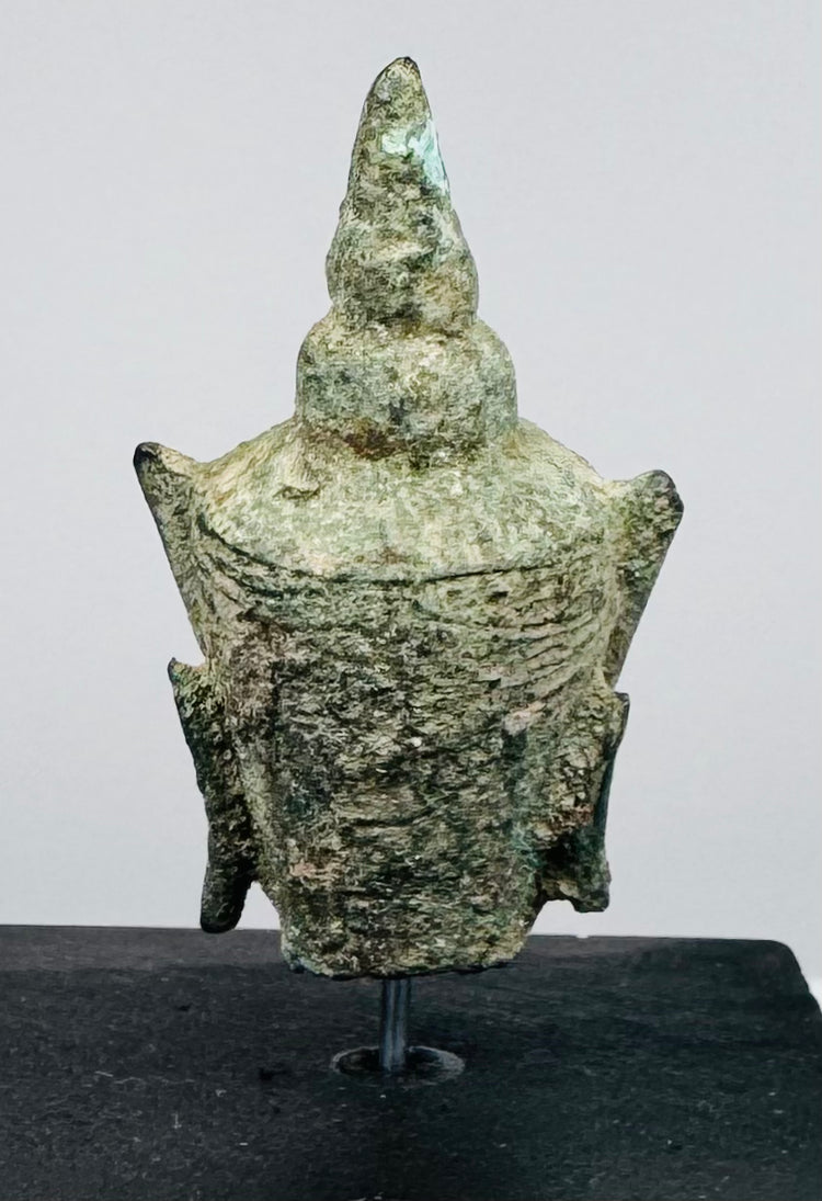 16th–17th century Buddhist sculpture featuring a finely cast bronze Buddha head with green oxidation