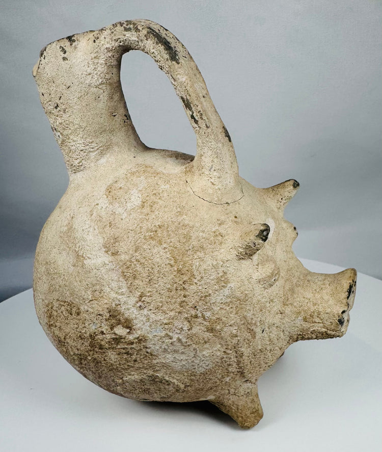 Ancient Anatolian Yortan Culture ceramic pig vessel featuring traces of white slip and archaeological patina.
