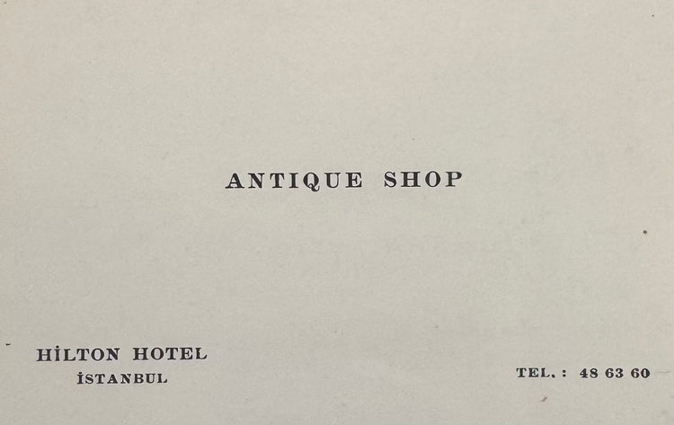 Original Hilton Hotel Antique Shop business card from Istanbul, Turkey, accompanying the documented provenance of the Ancient Yortan Culture terracotta pig-shaped vessel purchased on September 9, 1966.