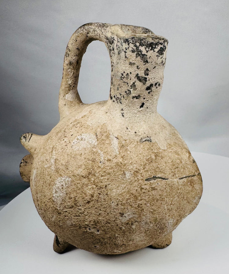 Hand-modeled terracotta zoomorphic vessel in the form of a pig from the Yortan Culture of ancient Anatolia.