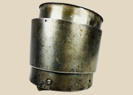 17th-century European siege armour arm guard, crafted from metal with riveted construction and aged patina from historic use.