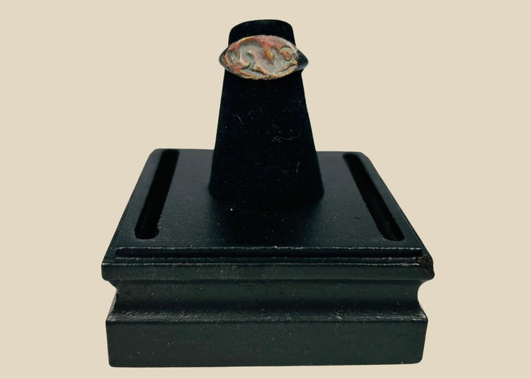 Ancient bronze ring from the Mediterranean or Near East, 1st–4th Century CE, featuring an oval bezel engraved with a horned bull symbolizing strength, power, and fertility. Natural green patina and finely detailed engraving preserve the historical artistry and cultural significance of this antiquity.