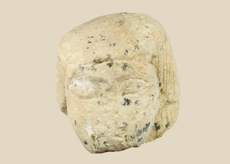 Egyptian limestone canopic jar lid, New Kingdom (1550–1070 BCE), carved in the likeness of Imsety, human-headed son of Horus, with aged patina and mounted display base.