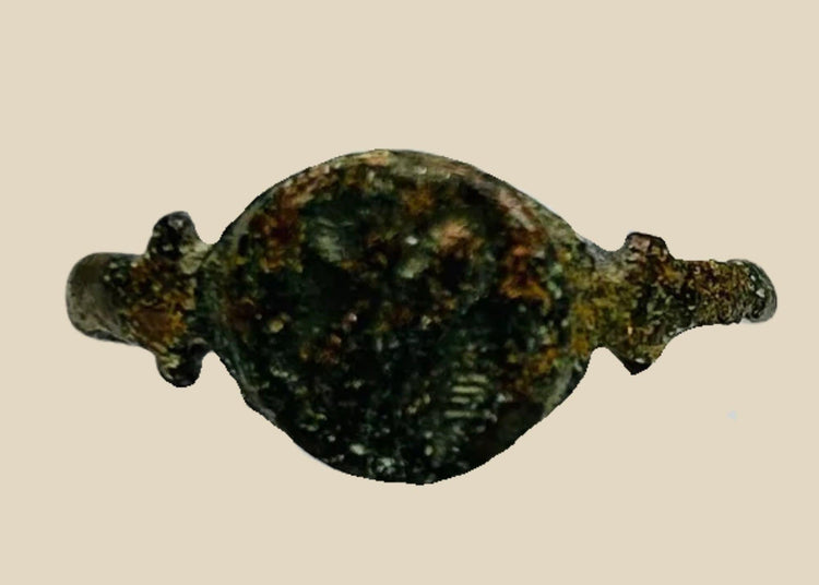 Ancient Roman cast bronze seal ring, 1st–3rd Century CE, featuring an engraved hippocampus on the bezel. Symbolic of Neptune and Roman maritime power, used as a personal seal and adornment. Developed patina reflects age and authenticity, with the bezel design well-preserved despite a broken band.