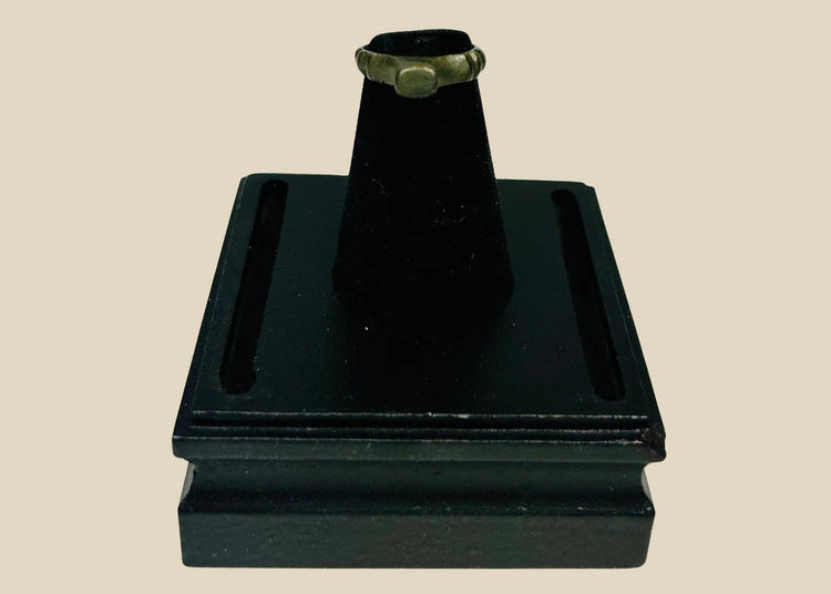 Authentic Roman bronze signet ring, circa 100–300 CE, with rounded band and flat bezel once engraved for sealing documents. Worn smooth from centuries of use, with deep green-black patina and earthen encrustations, a tangible relic of Roman identity.