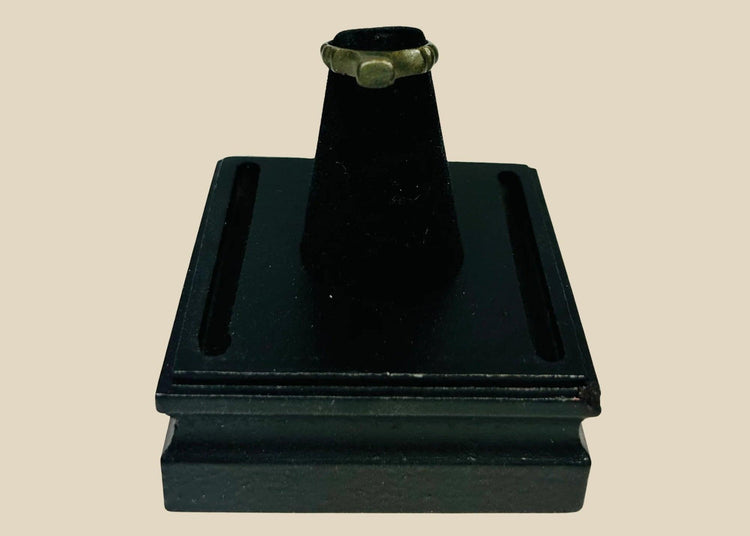 Authentic Roman bronze signet ring, circa 100–300 CE, with rounded band and flat bezel once engraved for sealing documents. Worn smooth from centuries of use, with deep green-black patina and earthen encrustations, a tangible relic of Roman identity.