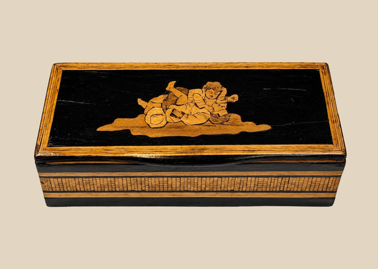 Anglo-Indian black lacquered marquetry trinket box with reclining figural inlay on lid, front view