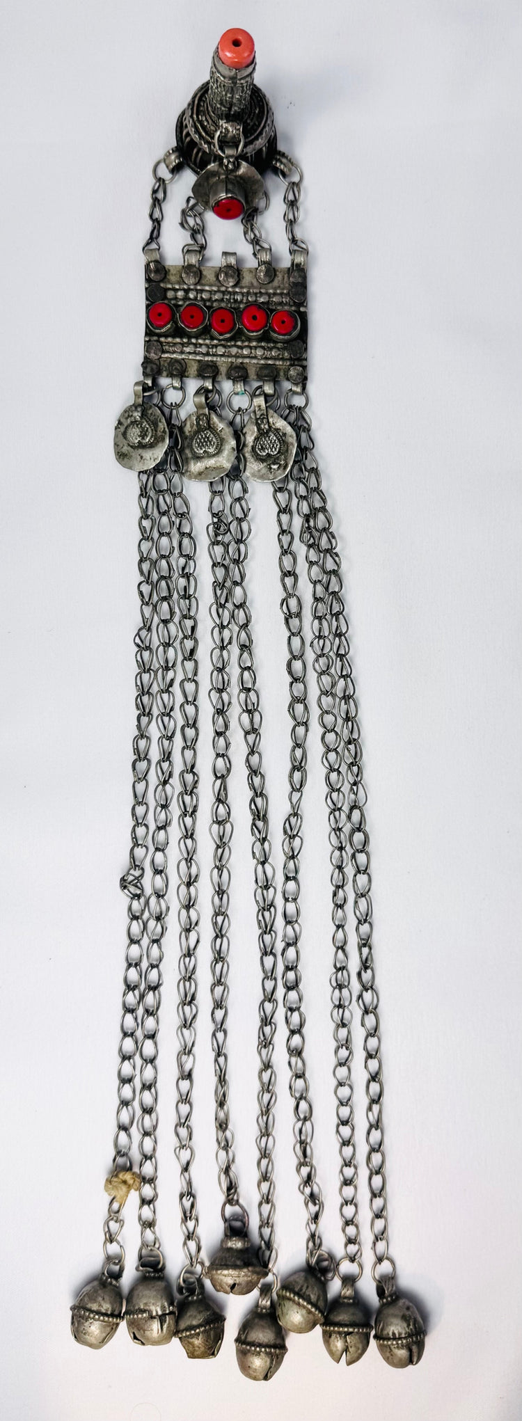 Traditional Afghan Kuchi ceremonial pendant featuring silver-toned metal, bell-shaped pendants, and protective hirz amulet.