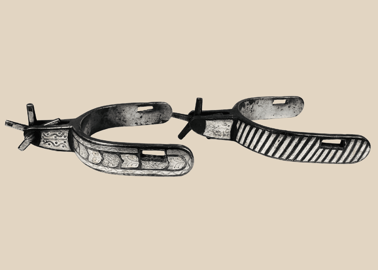 Pair of antique Western steel spurs with engraved silver inlay and five-point rowels