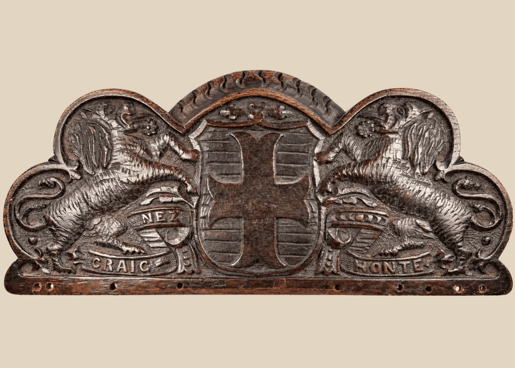 Antique Bentinck family heraldic oak pediment with cross moline, paired lions, and Craignez Honte motto