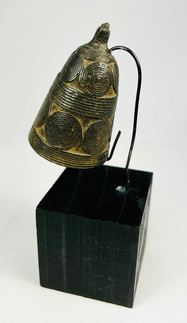 Traditional Himalayan bronze ghanta with lotus border and vajra handle finial.