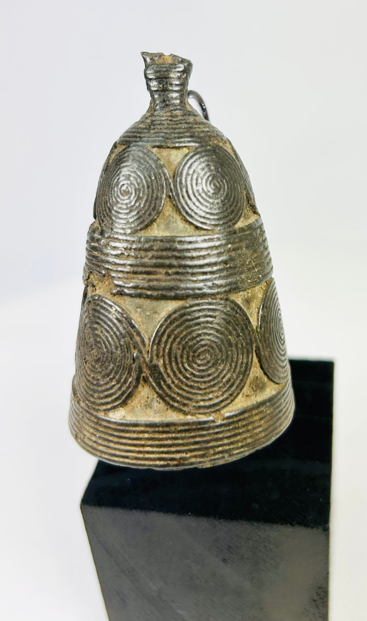 Tibetan ritual ghanta bell displaying detailed casting and traditional Buddhist symbolism.