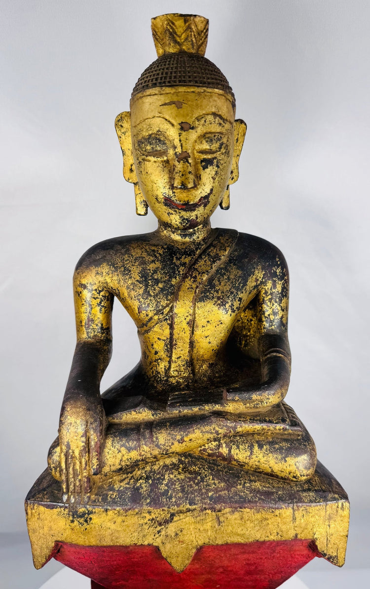 Hand-carved Shan (Tai Yai) seated Buddha from Myanmar with traces of original gilding.