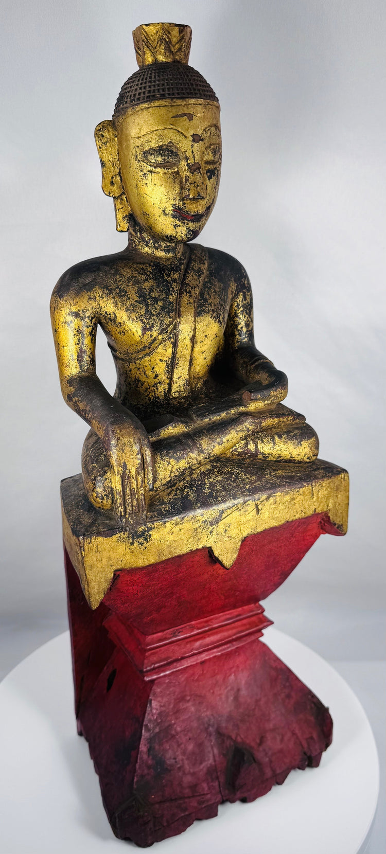 Traditional Shan Buddhist sculpture featuring the sacred Bhumisparsha Mudra gesture.