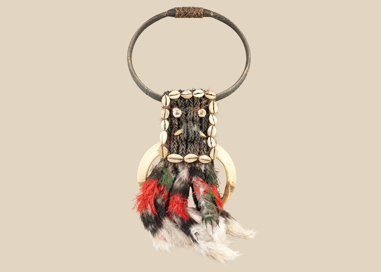 20th century Papua New Guinea tribal ceremonial necklace, braided plant fiber with shell and bone elements, red and black feathers, Oceanic ritual ornament, mounted for display