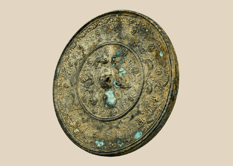 Antique Chinese bronze mirror with sea creature motifs in Tang Dynasty style