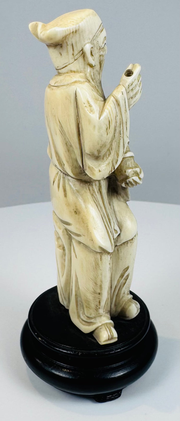 Side view showing the flowing robes and fish drum of Zhang Guolao