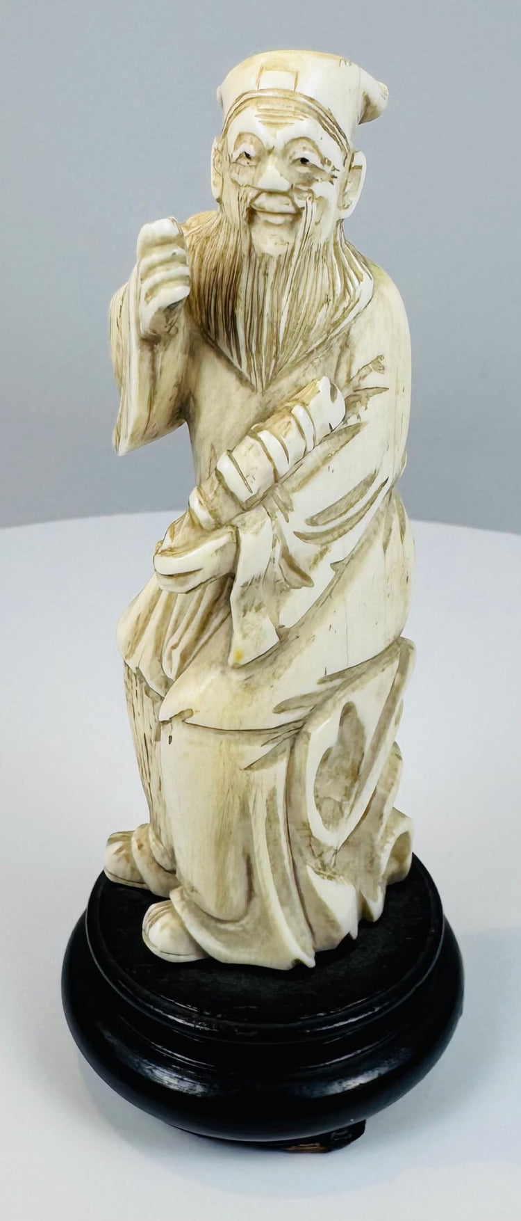 Chinese Eight Immortals carving of Zhang Guolao on an ebonized wood base