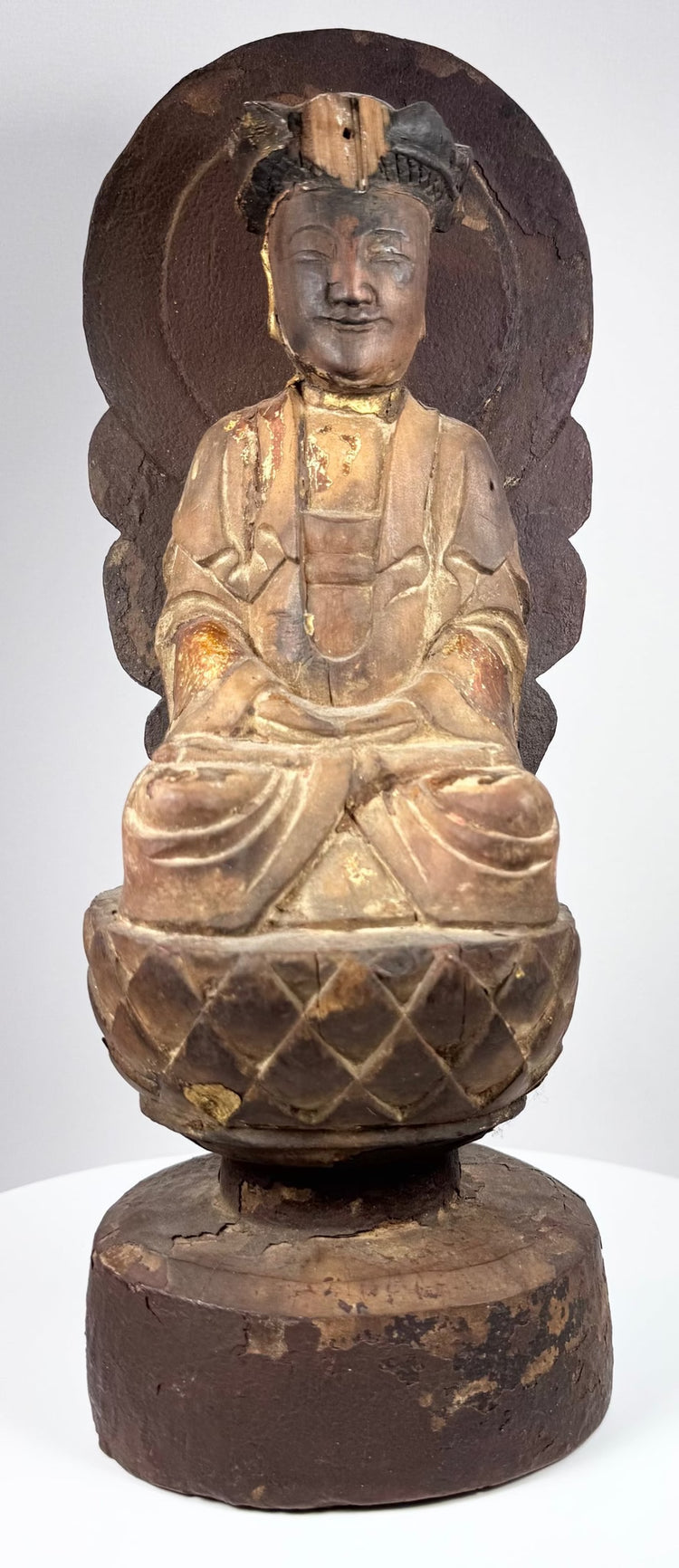 Chinese Buddhist Guanyin seated in meditation with hands arranged in dhyana mudra and flowing ceremonial robes