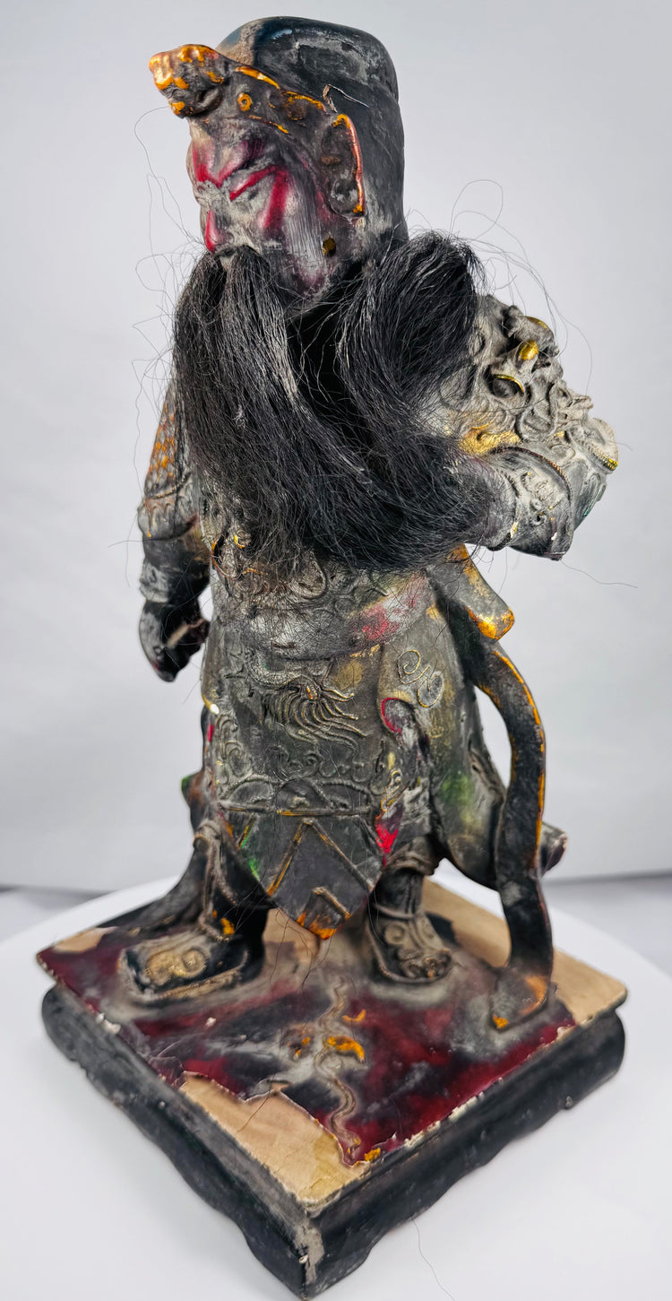 Antique polychrome Guan Gong sculpture with cloud, flame, and scale motifs