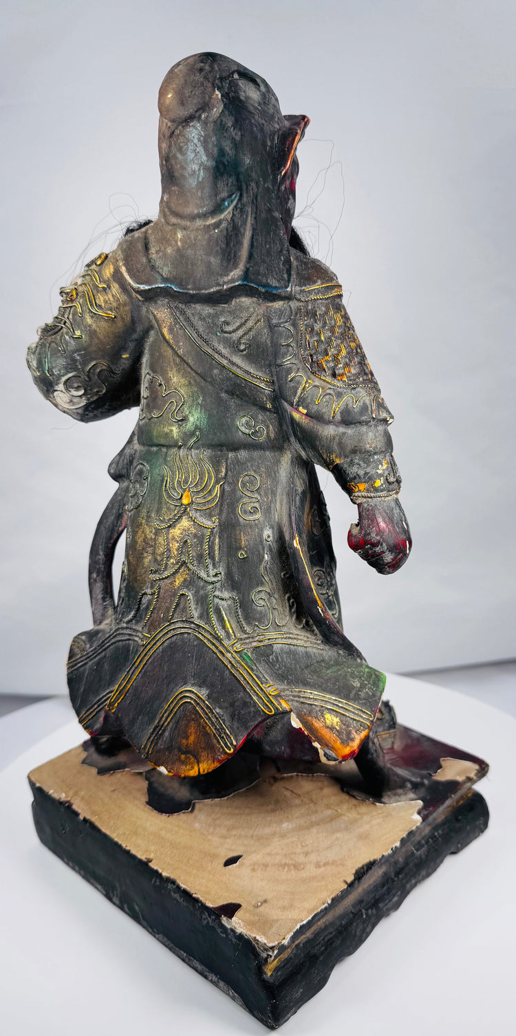Antique Chinese warrior deity sculpture with gilt details and dragon-form armour