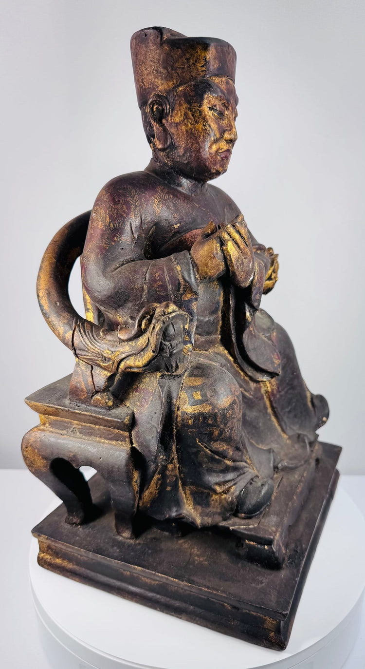 Detail of elaborate Chinese ceremonial throne showing carved hand- or claw-like terminals and decorative arm supports
