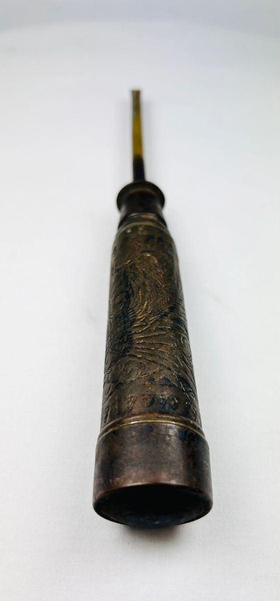 Detail of engraved Chinese characters on an antique Late Qing Dynasty temple candle holder