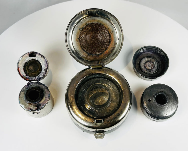 Antique compact writing kit with ink pots showing patina and use wear