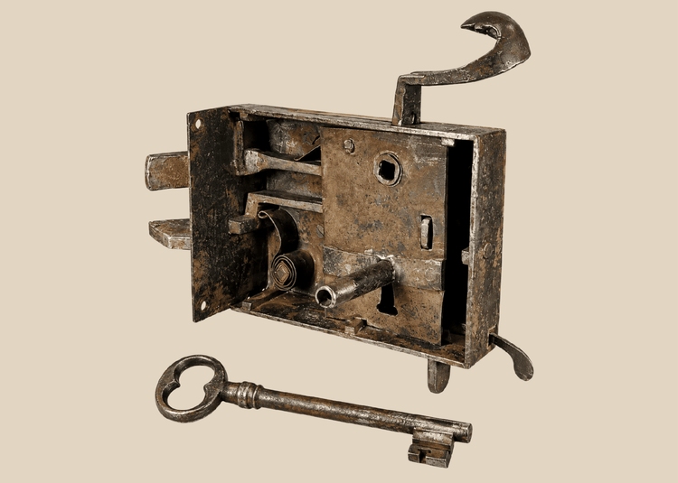 Antique iron door lock mechanism with visible internal bolts and large key