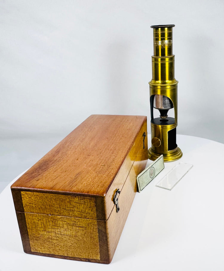 French-style nineteenth century brass microscope with original specimen slides and storage case