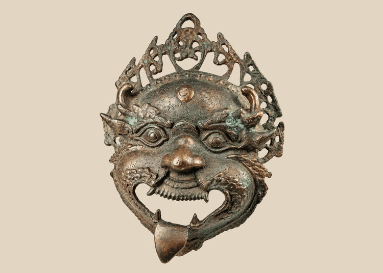 Antique Himalayan bronze Mahakala ritual mask with filigree crown and green patina