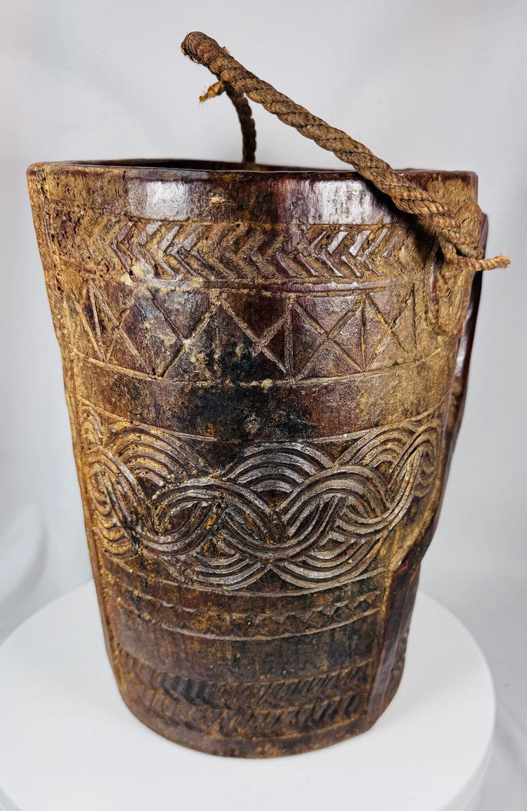 Carved hardwood dairy or provision vessel from Tibet or Nepal with original rope handle