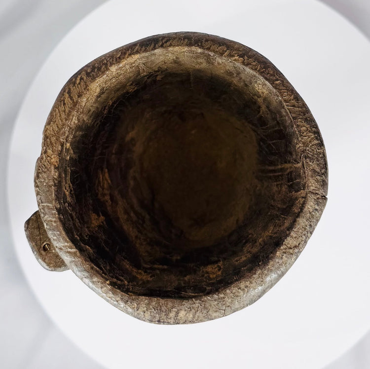 Antique Nepal or Tibet wooden domestic vessel displaying extensive age wear and natural wood texture