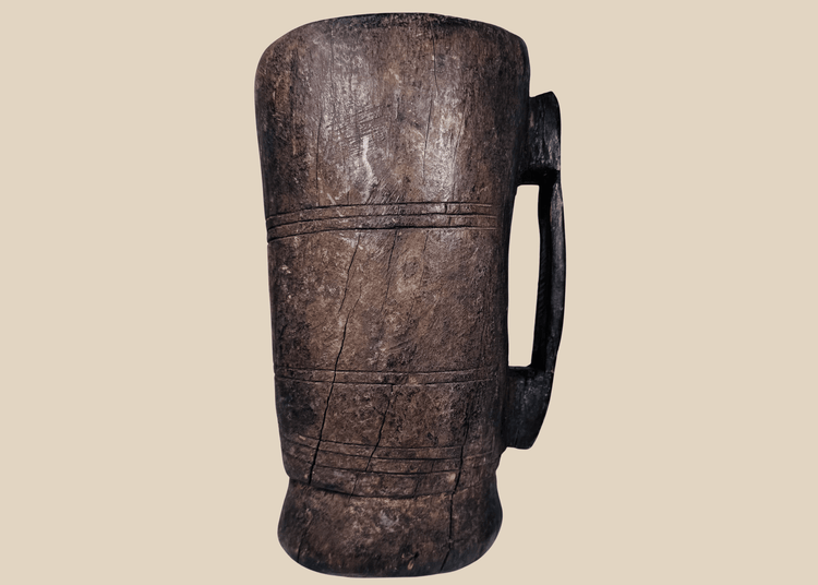 Antique Himalayan hand-carved wooden vessel traditionally used for yak milk or butter storage