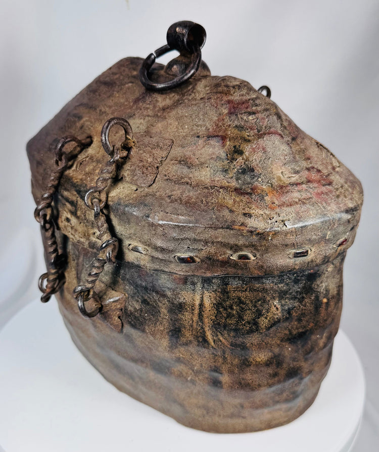 Handwoven Himalayan travel container with aged leather covering and rich patina